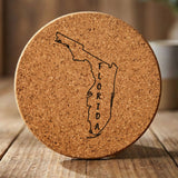 Florida round cork coaster engraved with the state outline and FLORIDA running vertically