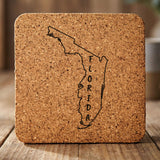 Florida square cork coaster engraved with the state outline and FLORIDA running vertically
