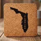 Florida square cork coaster with the engraved state shape and FLORIDA running vertically