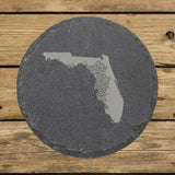Florida round slate coaster engraved with the state shape in ornate floral scrollwork