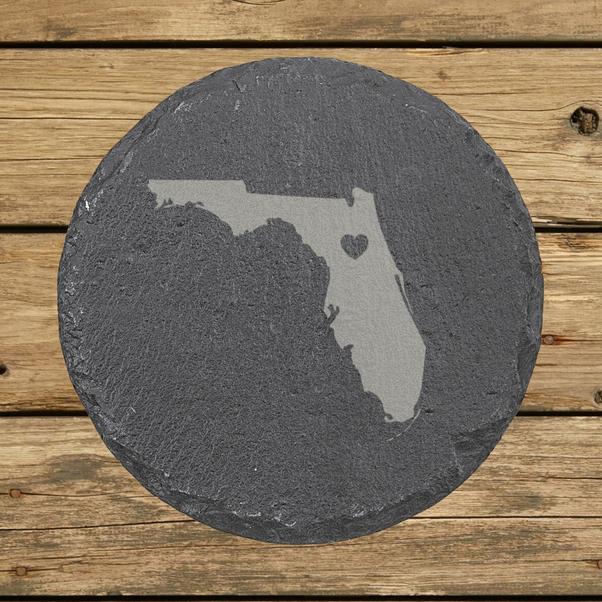 Florida round slate coaster engraved with the state shape and a heart