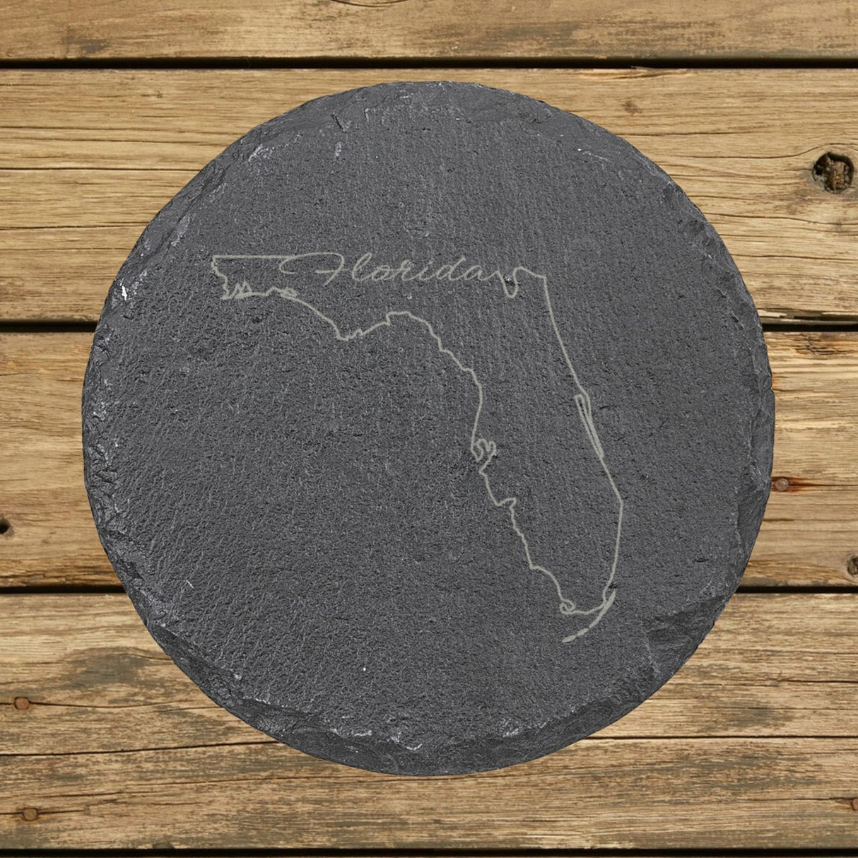 Florida round slate coaster engraved with the state outline and Florida in script lettering