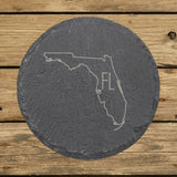 Florida round slate coaster engraved with the state outline and FL initials