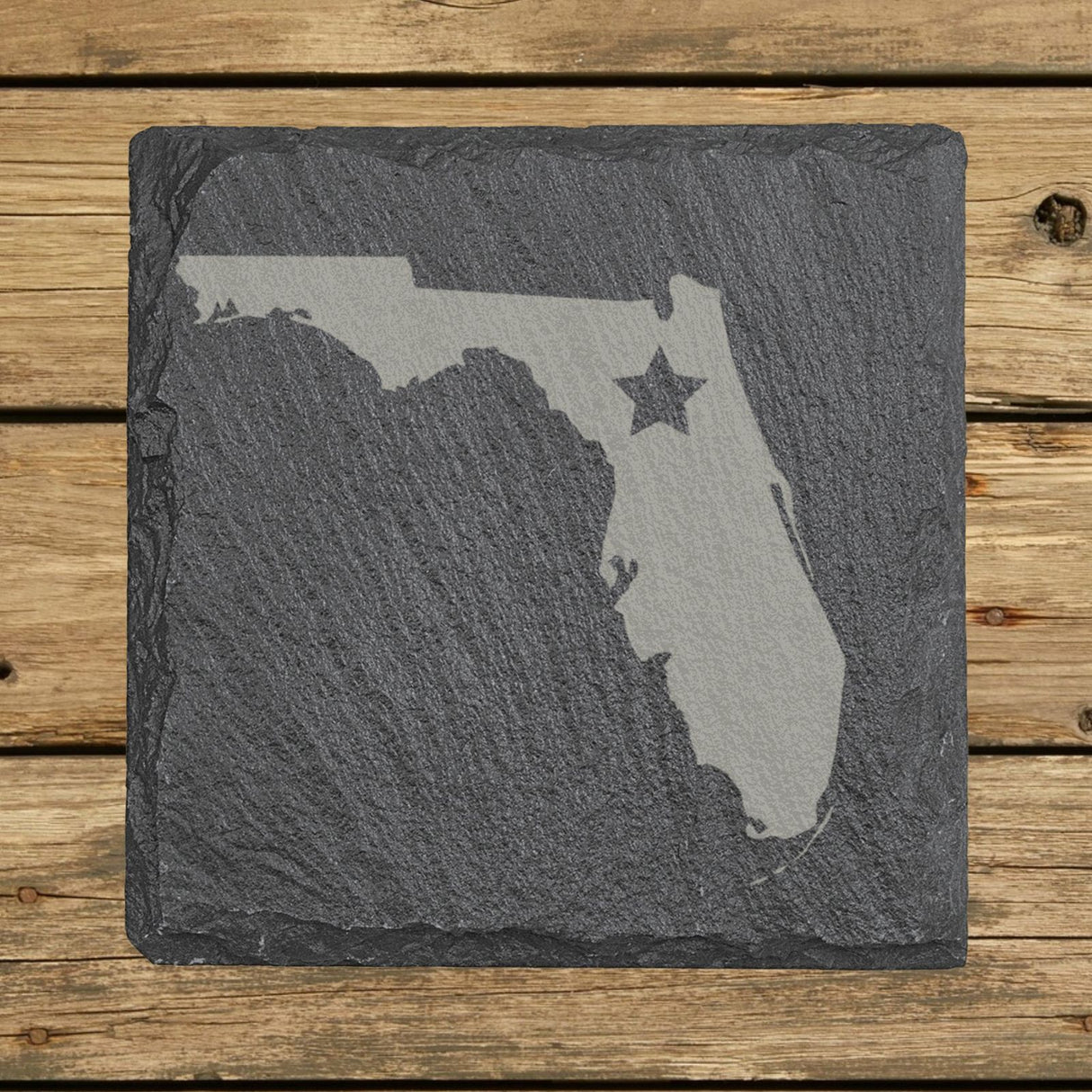 Florida square slate coaster engraved with the state shape and a star