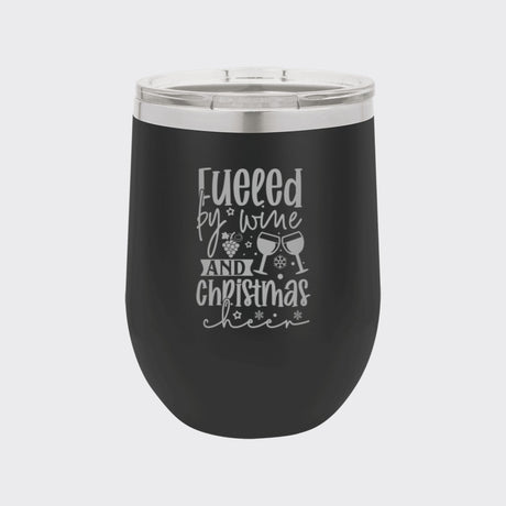 Black 12 oz stemless wine tumbler laser engraved with "Fueled by Wine and Christmas Cheer"