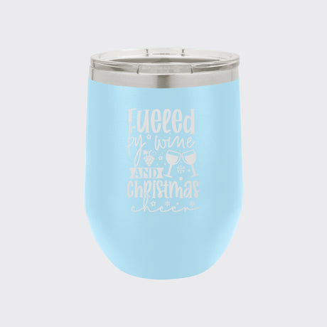 Light Blue 12 oz stemless wine tumbler laser engraved with "Fueled by Wine and Christmas Cheer"