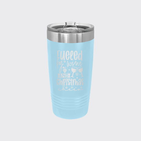 Light Blue 20 oz tumbler laser engraved with "Fueled by Wine and Christmas Cheer"