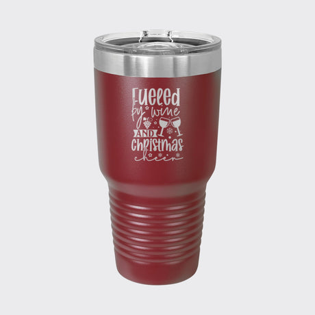 Maroon 30 oz tumbler laser engraved with "Fueled by Wine and Christmas Cheer"