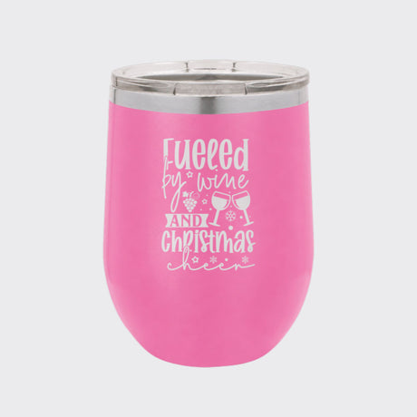 Pink 12 oz stemless wine tumbler laser engraved with "Fueled by Wine and Christmas Cheer"