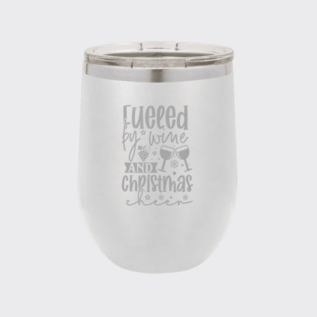 White 12 oz stemless wine tumbler laser engraved with "Fueled by Wine and Christmas Cheer"