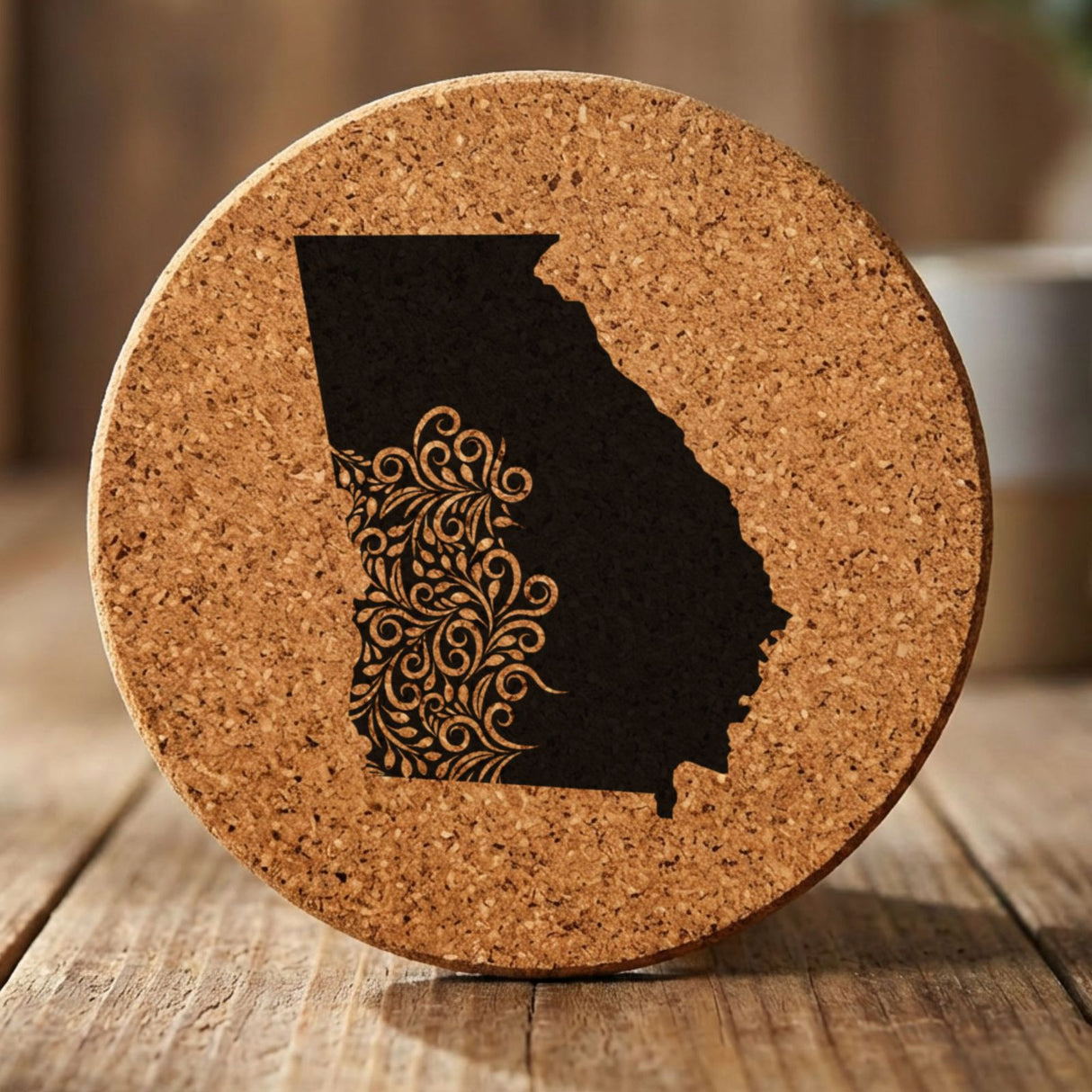 Georgia round cork coaster engraved with the state shape in ornate floral scrollwork