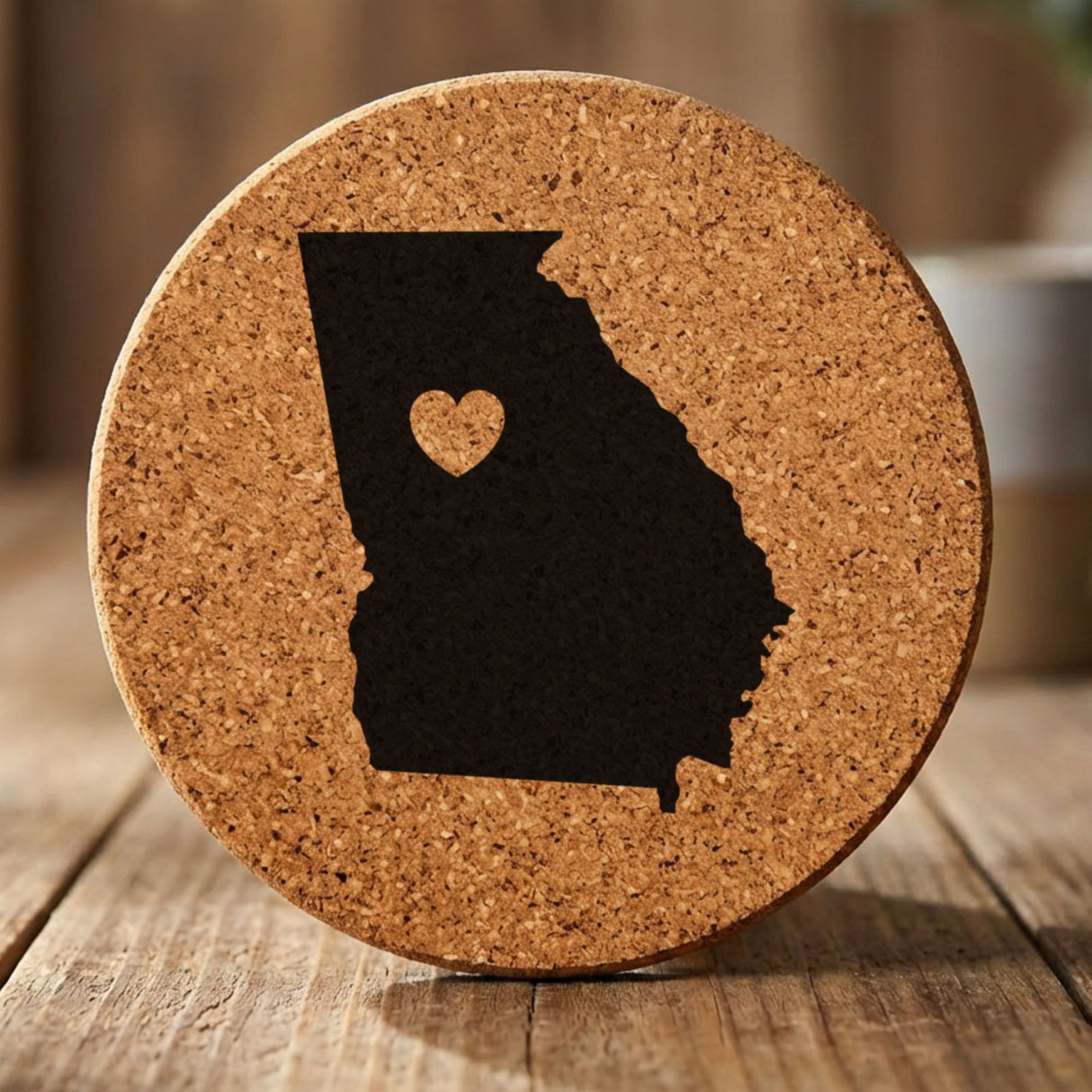 Georgia round cork coaster engraved with the state shape and a heart