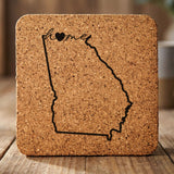 Georgia square cork coaster engraved with the state outline and home in script with a heart