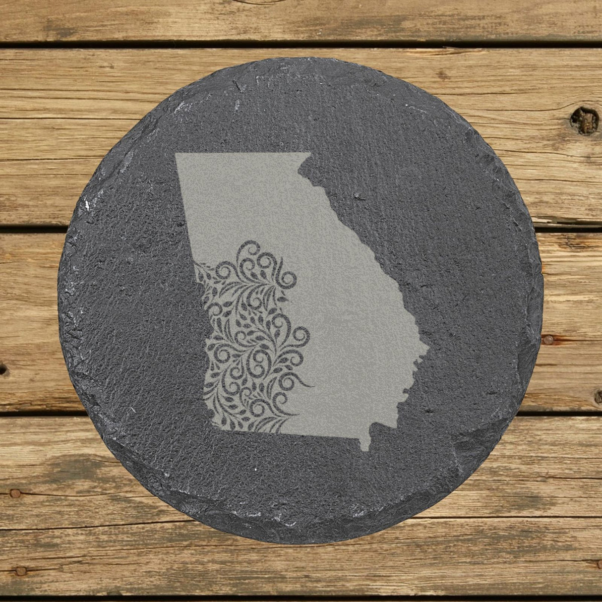 Georgia round slate coaster engraved with the state shape in ornate floral scrollwork