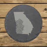 Georgia round slate coaster engraved with the state shape in ornate floral scrollwork