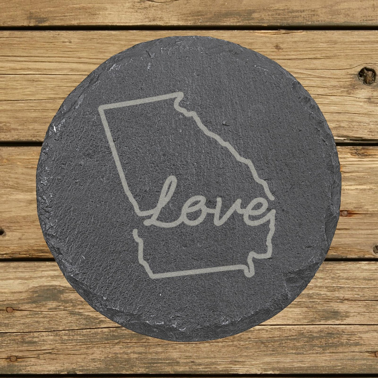 Georgia round slate coaster engraved with a hand-drawn state outline and love in cursive