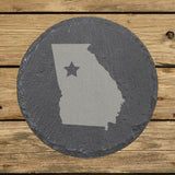 Georgia round slate coaster engraved with the state shape and a star