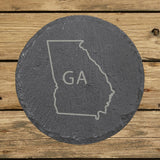 Georgia round slate coaster engraved with the state outline and GA initials