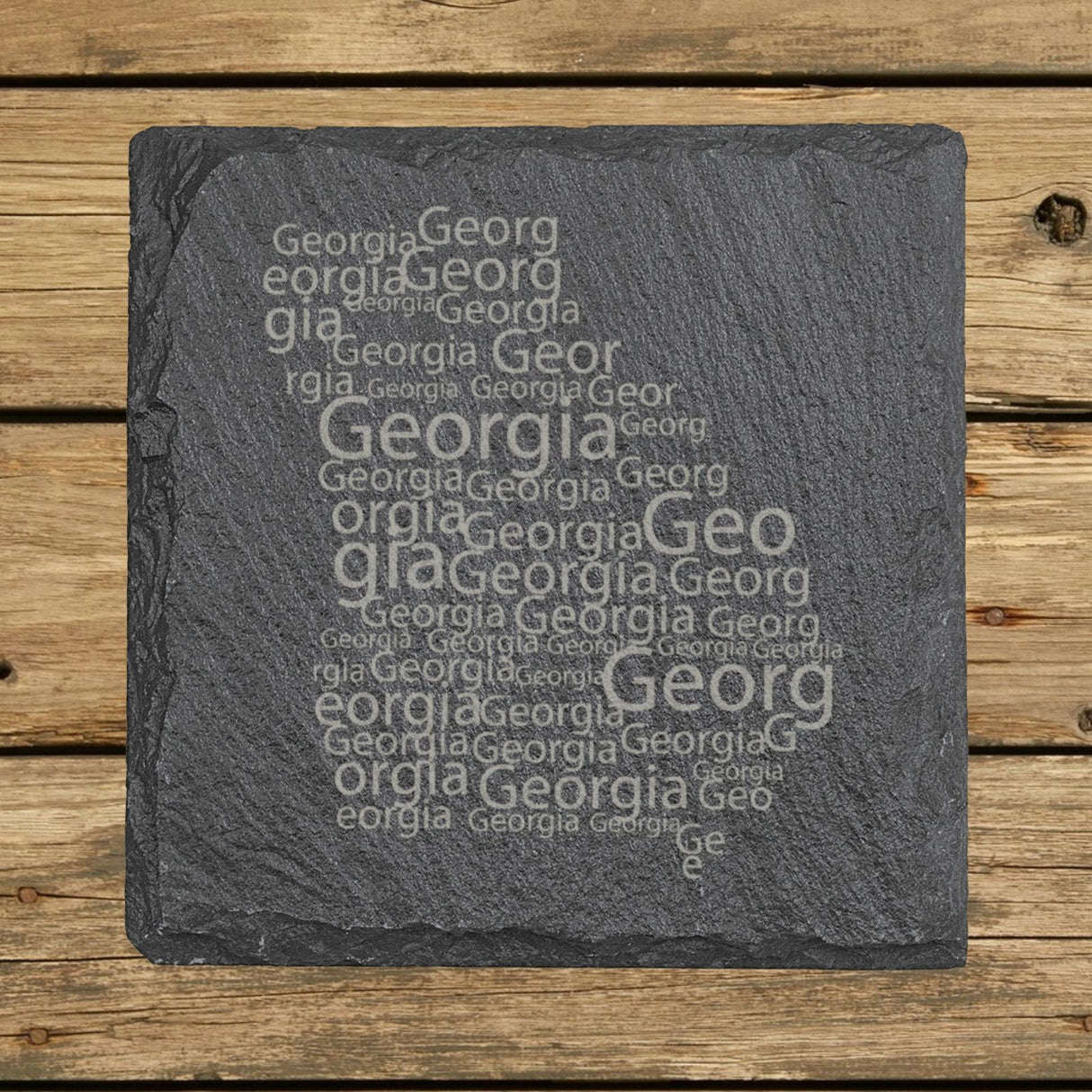 Georgia square slate coaster engraved with a word cloud of repeating Georgia text