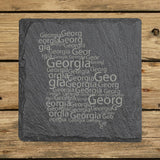 Georgia square slate coaster engraved with a word cloud of repeating Georgia text