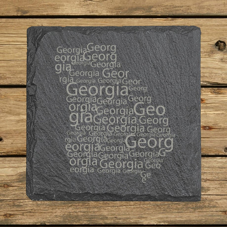 Georgia square slate coaster engraved with a word cloud of repeating Georgia text
