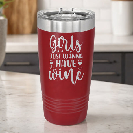 Maroon 20 oz tumbler laser engraved with "Girls Just Wanna Have Wine", on a kitchen counter