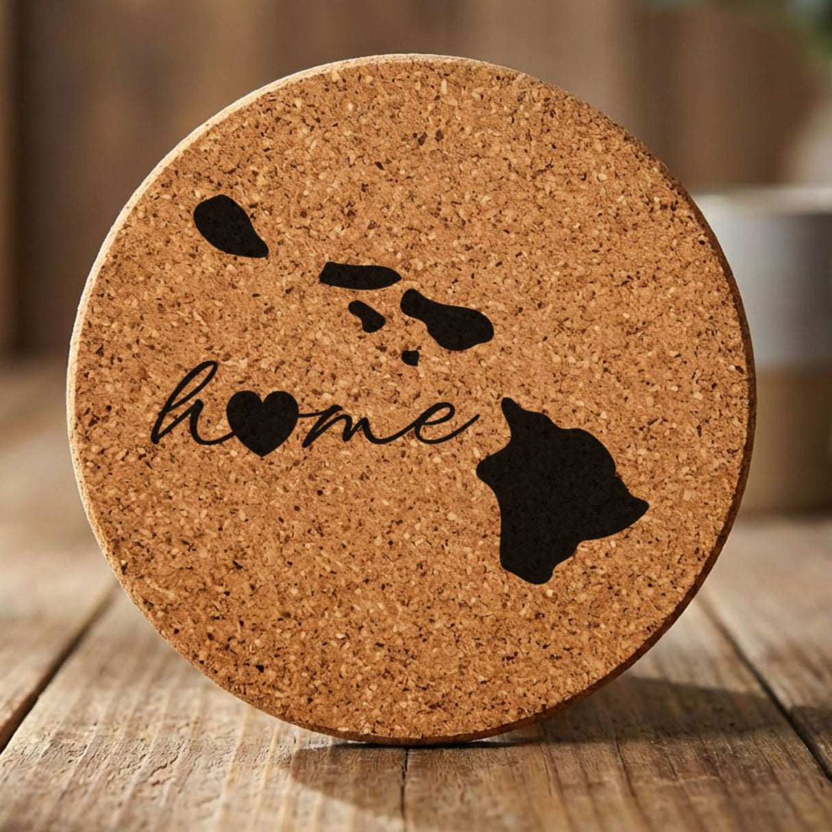 Hawaii round cork coaster engraved with the state outline and home in script with a heart