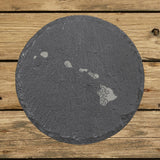 Hawaii round slate coaster engraved with the state shape in ornate floral scrollwork