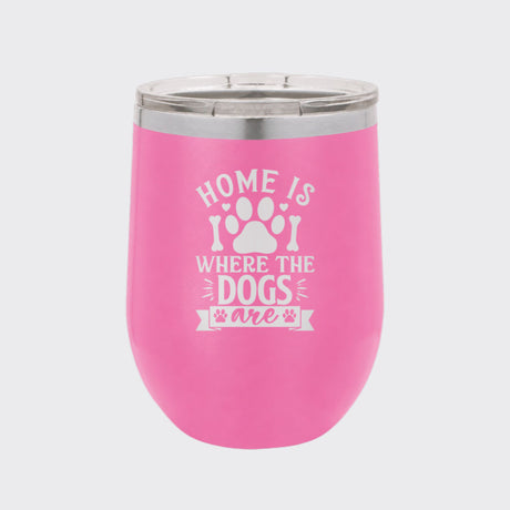 Pink 12 oz stemless wine tumbler laser engraved with "Home Is Where the Dogs Are"
