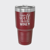 Maroon 30 oz tumbler laser engraved with "I Pair Well with Wine"