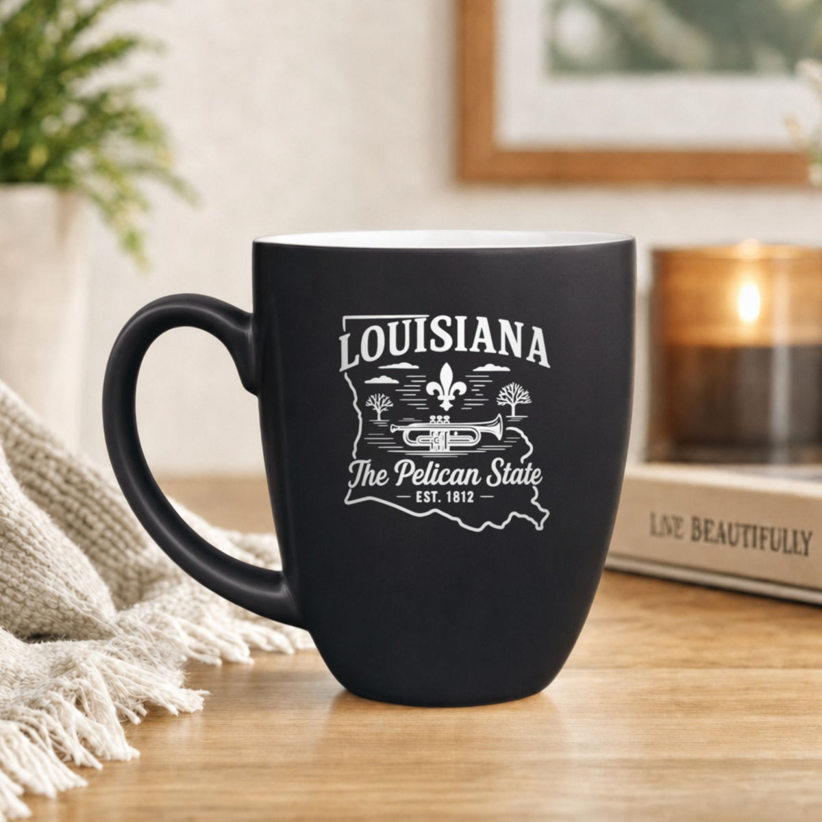 Black 16 oz ceramic coffee mug printed with the Louisiana state outline and The Pelican State
