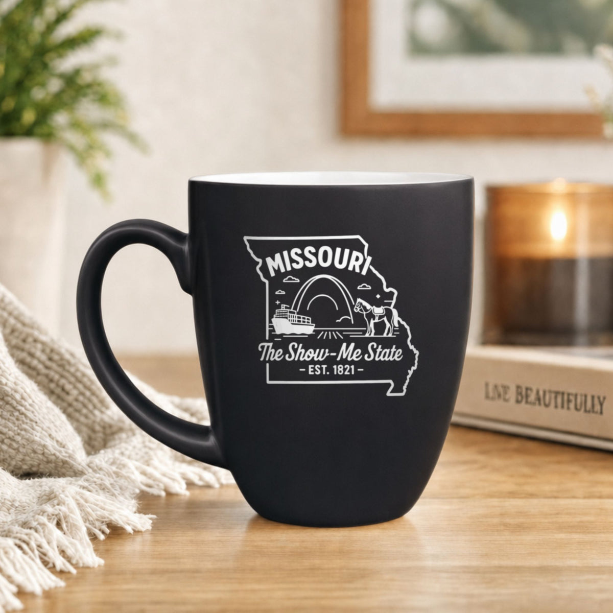 Black 16 oz ceramic coffee mug printed with the Missouri state outline and The Show-Me State