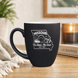 Black 16 oz ceramic coffee mug printed with the Missouri state outline and The Show-Me State