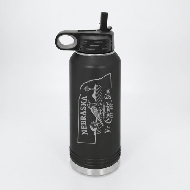Black 32 oz insulated water bottle laser engraved with a Nebraska design of a western meadowlark, a barn and a windmill