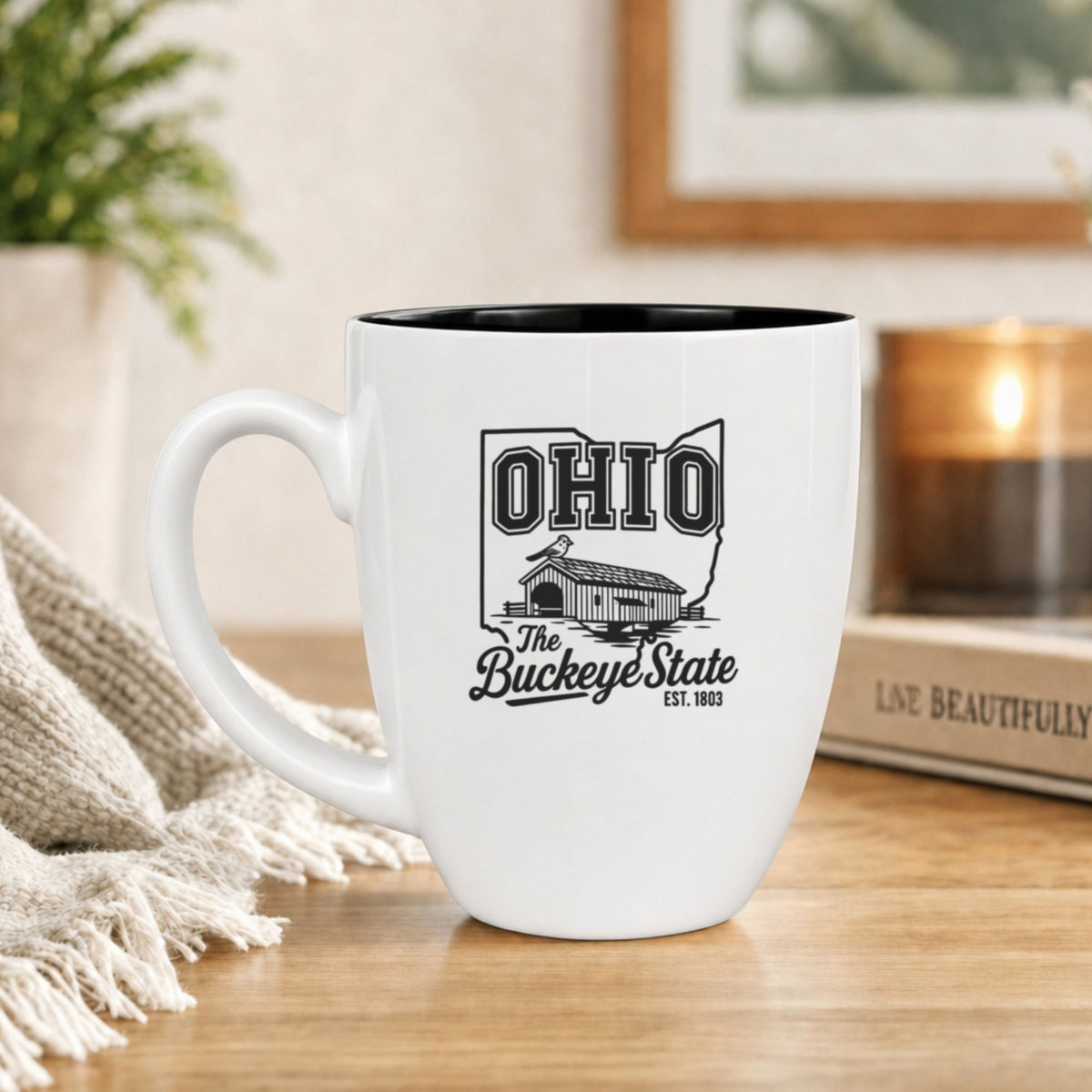 White 16 oz ceramic coffee mug printed with the Ohio state outline and The Buckeye State
