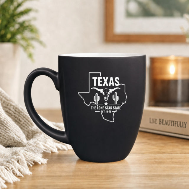 Black 16 oz ceramic coffee mug printed with the Texas state outline and The Lone Star State