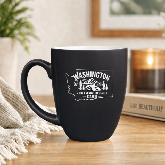 Black 16 oz ceramic coffee mug printed with the Washington state outline and The Evergreen State