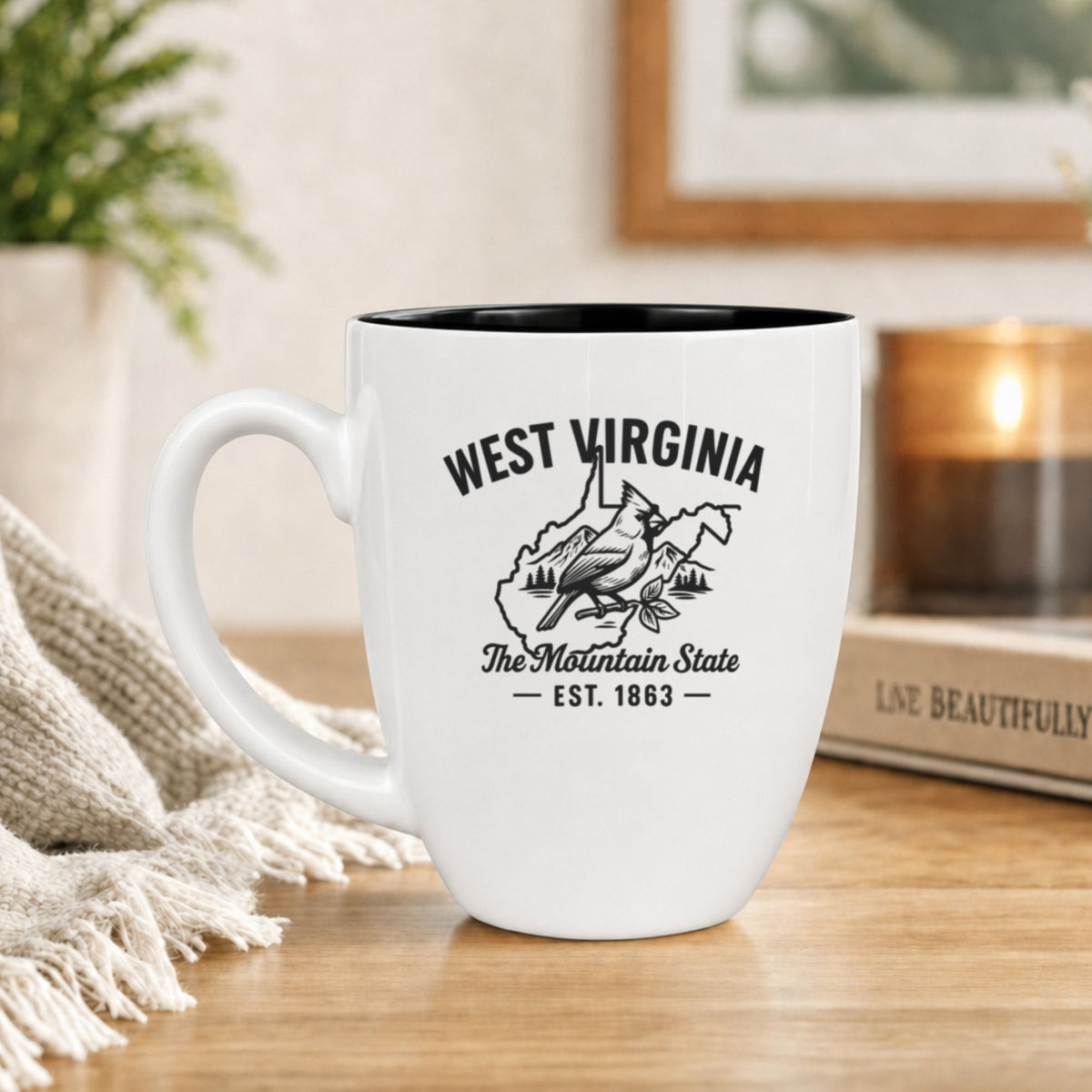 White 16 oz ceramic coffee mug printed with the West Virginia state outline and The Mountain State