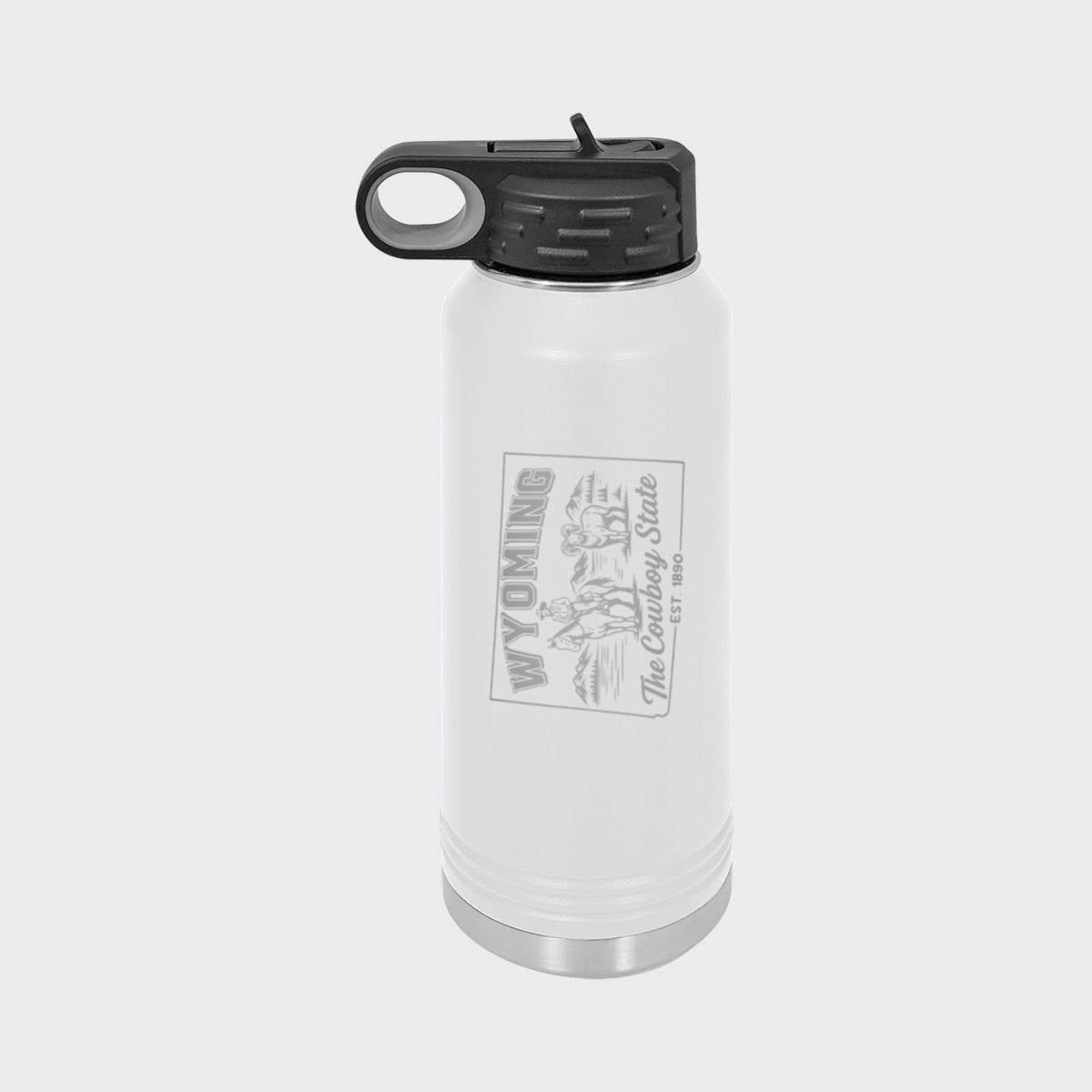 White 32 oz insulated water bottle laser engraved with a Wyoming design of a cowboy on horseback, a bighorn sheep and mountains
