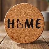 Idaho round cork coaster engraved with HOME using the state outline as the letter O