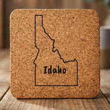 Idaho square cork coaster engraved with the state outline and IDAHO in hand-drawn brush lettering