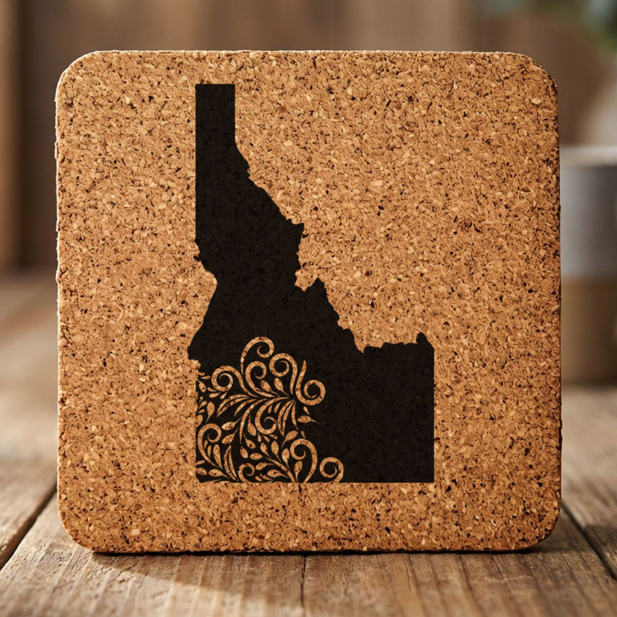 Idaho square cork coaster engraved with the state shape in ornate floral scrollwork