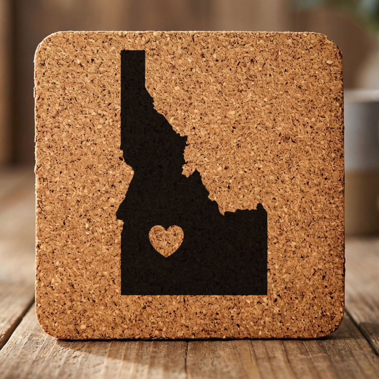 Idaho square cork coaster engraved with the state shape and a heart