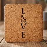 Idaho square cork coaster engraved with LOVE stacked vertically using the state as the letter O