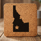 Idaho square cork coaster engraved with the state shape and a star