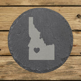 Idaho round slate coaster engraved with the state shape and a heart