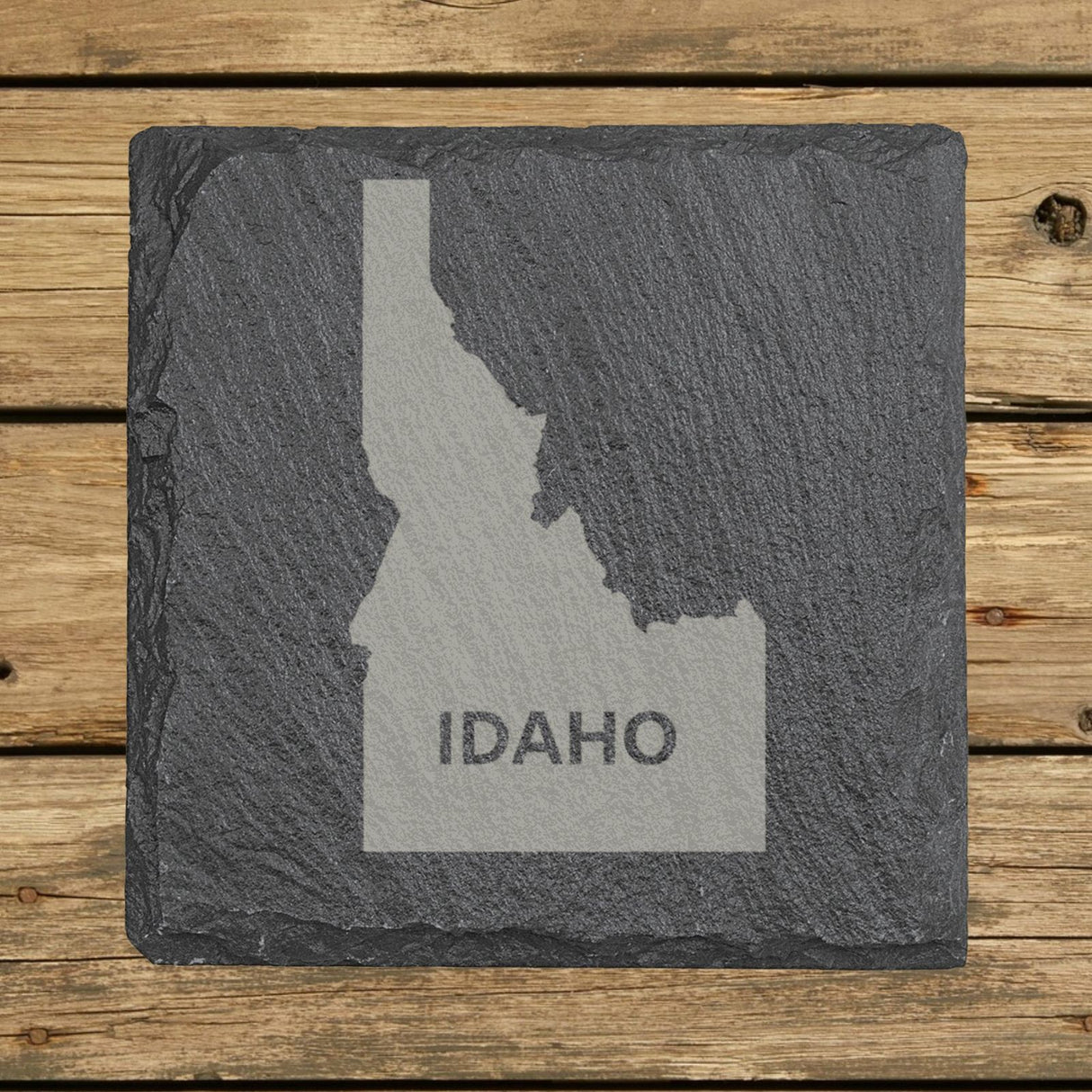 Idaho square slate coaster engraved with the state shape and IDAHO in bold lettering