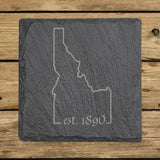 Idaho square slate coaster engraved with the state outline and est. 1890