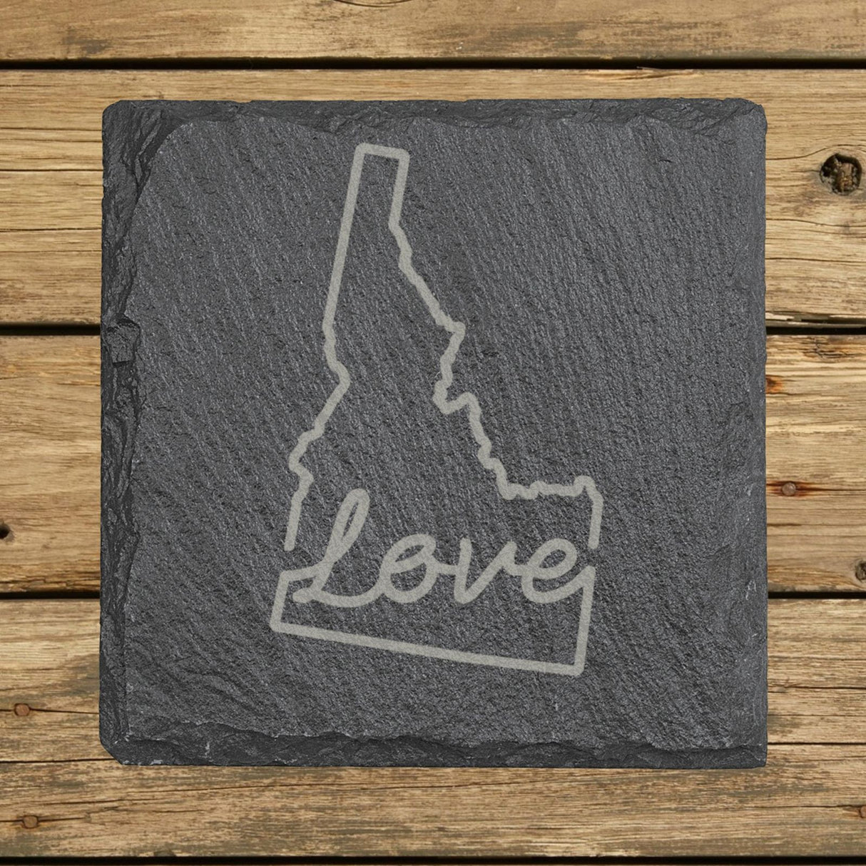 Idaho square slate coaster engraved with a hand-drawn state outline and love in cursive
