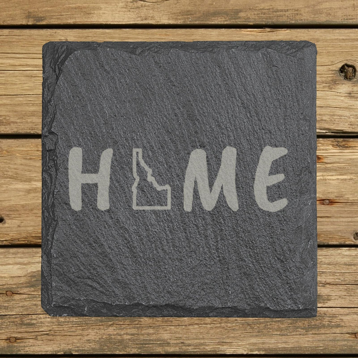 Idaho square slate coaster engraved with HOME using the state outline as the letter O